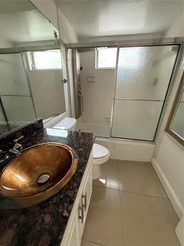 a view of a kitchen with a sink