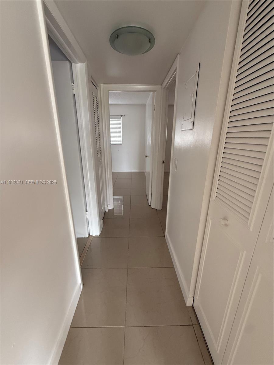 Arrowhead Condominium Davie, FL 33324 - Photo 18 of 35 a view of a hallway with wooden floor