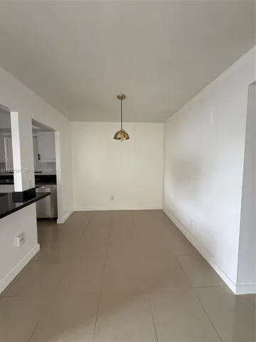 a kitchen with stainless steel appliances a refrigerator sink and microwave