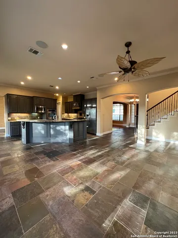 a view of a kitchen with a sink and a window