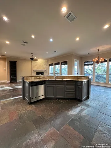 a kitchen with stainless steel appliances a sink and cabinets