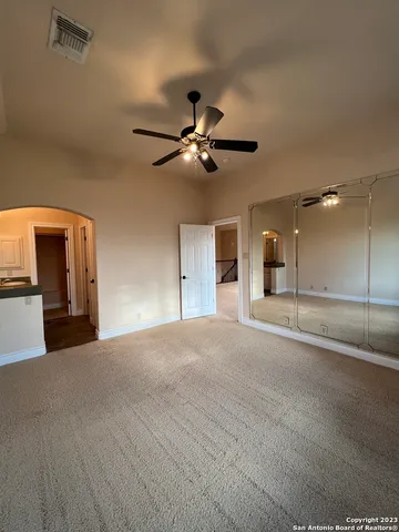 a spacious bathroom with a sink and a window