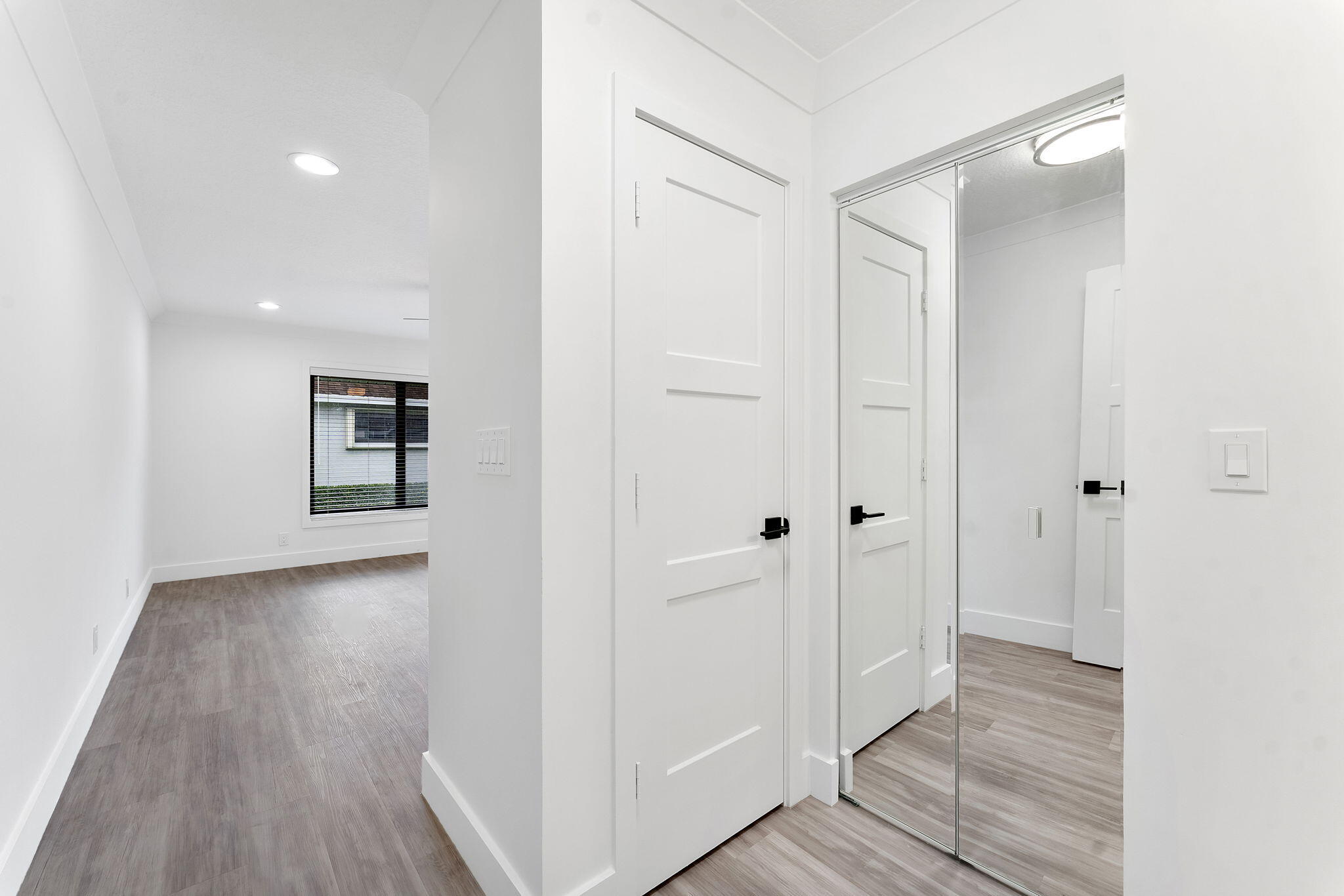 9840 Chestnut Tree Terrace, Unit A Boynton Beach, FL 33436 - Photo 20 of 27 a view of a hallway with wooden floor