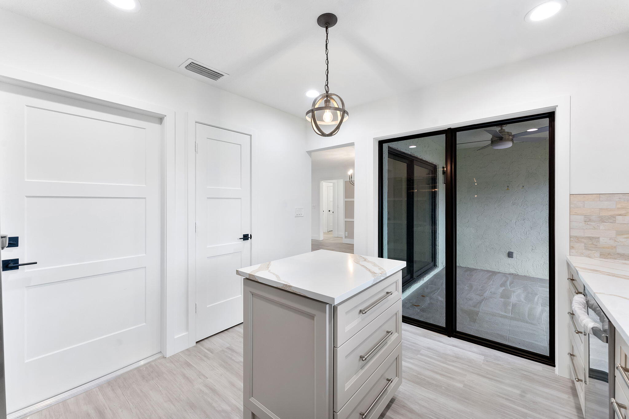 9840 Chestnut Tree Terrace, Unit A Boynton Beach, FL 33436 - Photo 10 of 27 a view of hallway with granite countertop cabinets