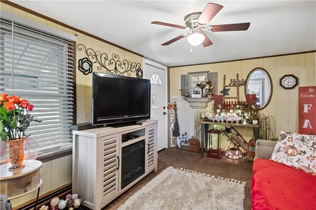 a living room with furniture and a flat screen tv
