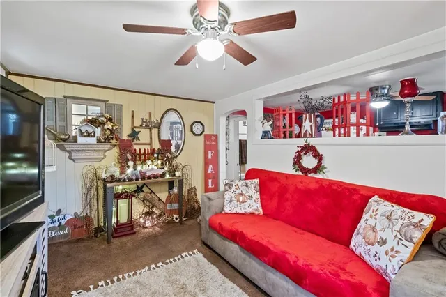 a living room with furniture and a flat screen tv