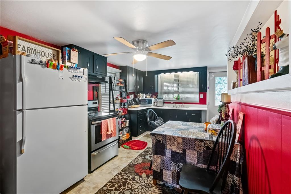 718 Gladden Road Canonsburg, PA 15317 - Photo 16 of 28 a open kitchen with stainless steel appliances granite countertop a refrigerator and a stove