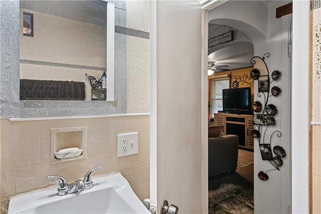 718 Gladden Road Canonsburg, PA 15317 - Photo 19 of 28 a en suite bathroom with a sink and a mirror