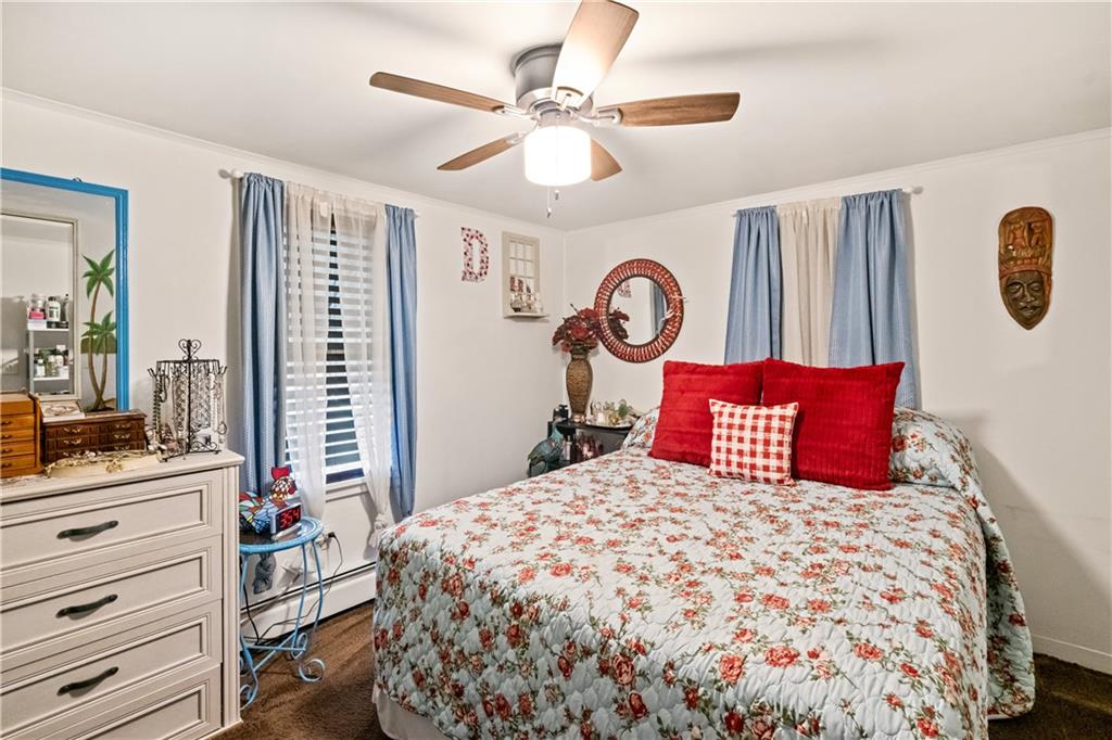 718 Gladden Road Canonsburg, PA 15317 - Photo 20 of 28 a bedroom with a large bed and a chandelier