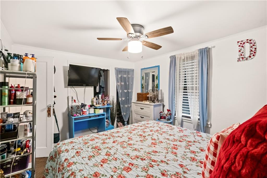 718 Gladden Road Canonsburg, PA 15317 - Photo 22 of 28 a bedroom with a bed and a flat tv screen on dresser