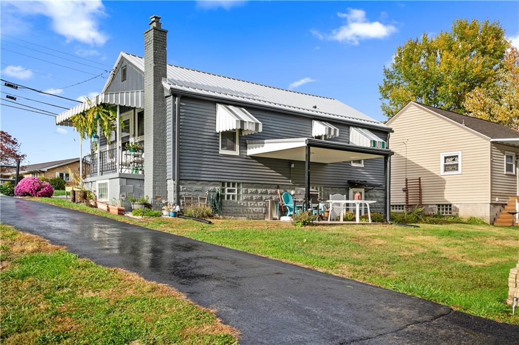 718 Gladden Road Canonsburg, PA 15317 - Photo 4 of 28 a front view of a house with a yard