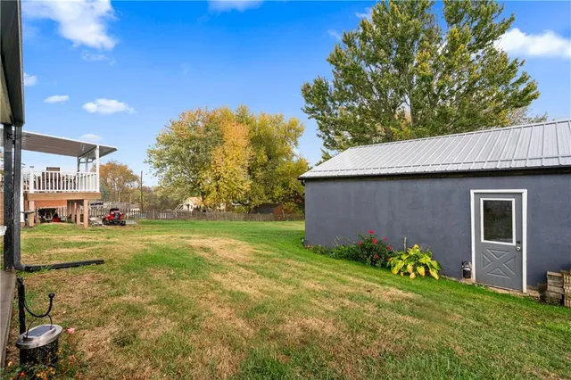 a backyard of a house with wooden fence