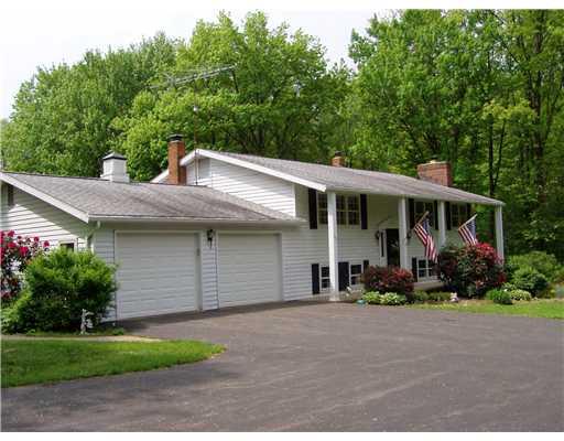 Exterior Front. Front of house, garage and paved driveway and turn-around.