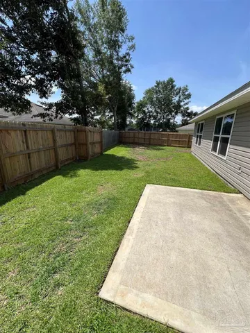 a view of a backyard with green space