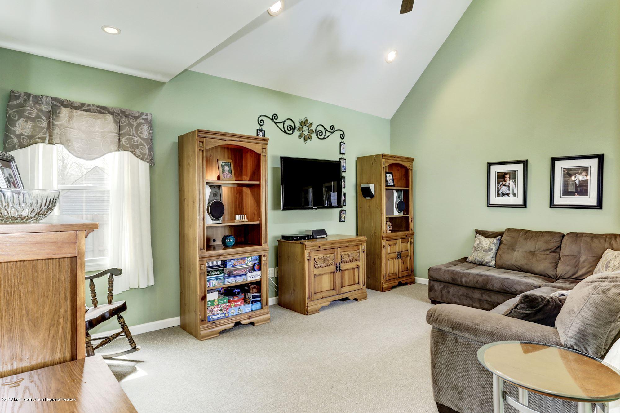 132 Brandon Road Manchester Township, NJ 08759 - Photo 2 of 24 a living room with furniture and a flat screen tv