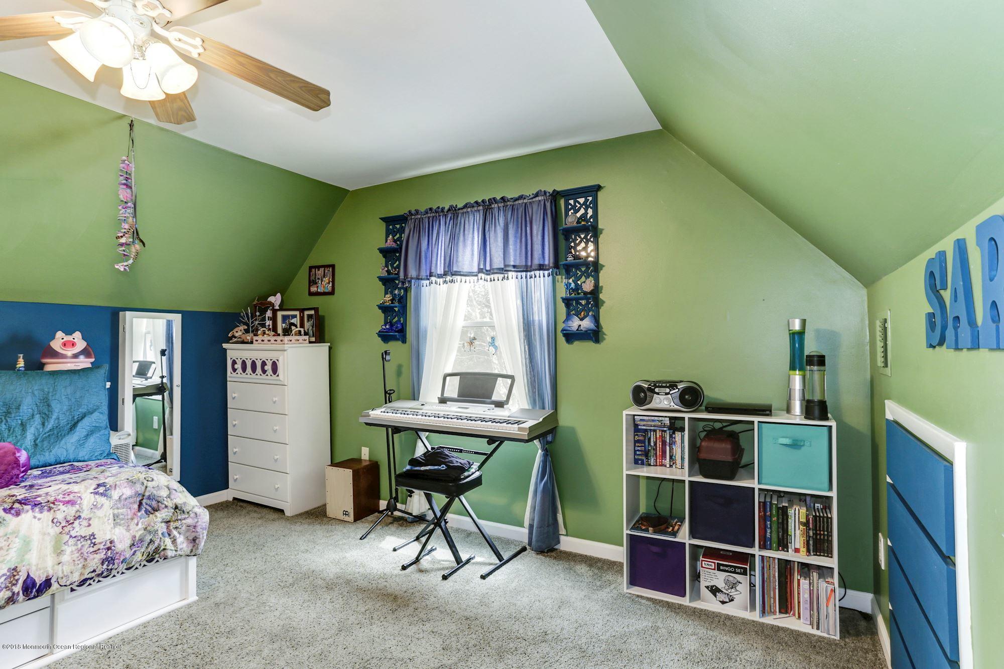 132 Brandon Road Manchester Township, NJ 08759 - Photo 12 of 24 a room with furniture and a chair
