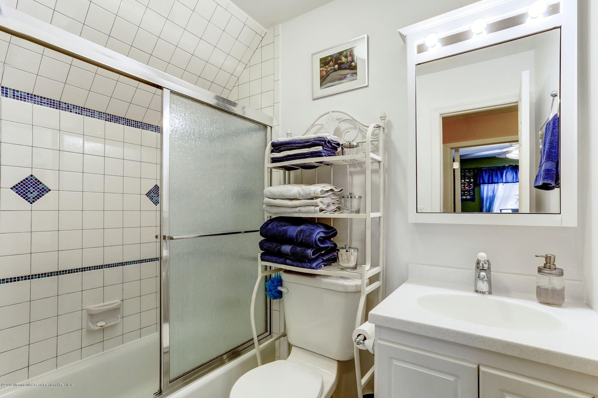 132 Brandon Road Manchester Township, NJ 08759 - Photo 13 of 24 a bathroom with a sink a toilet and shower