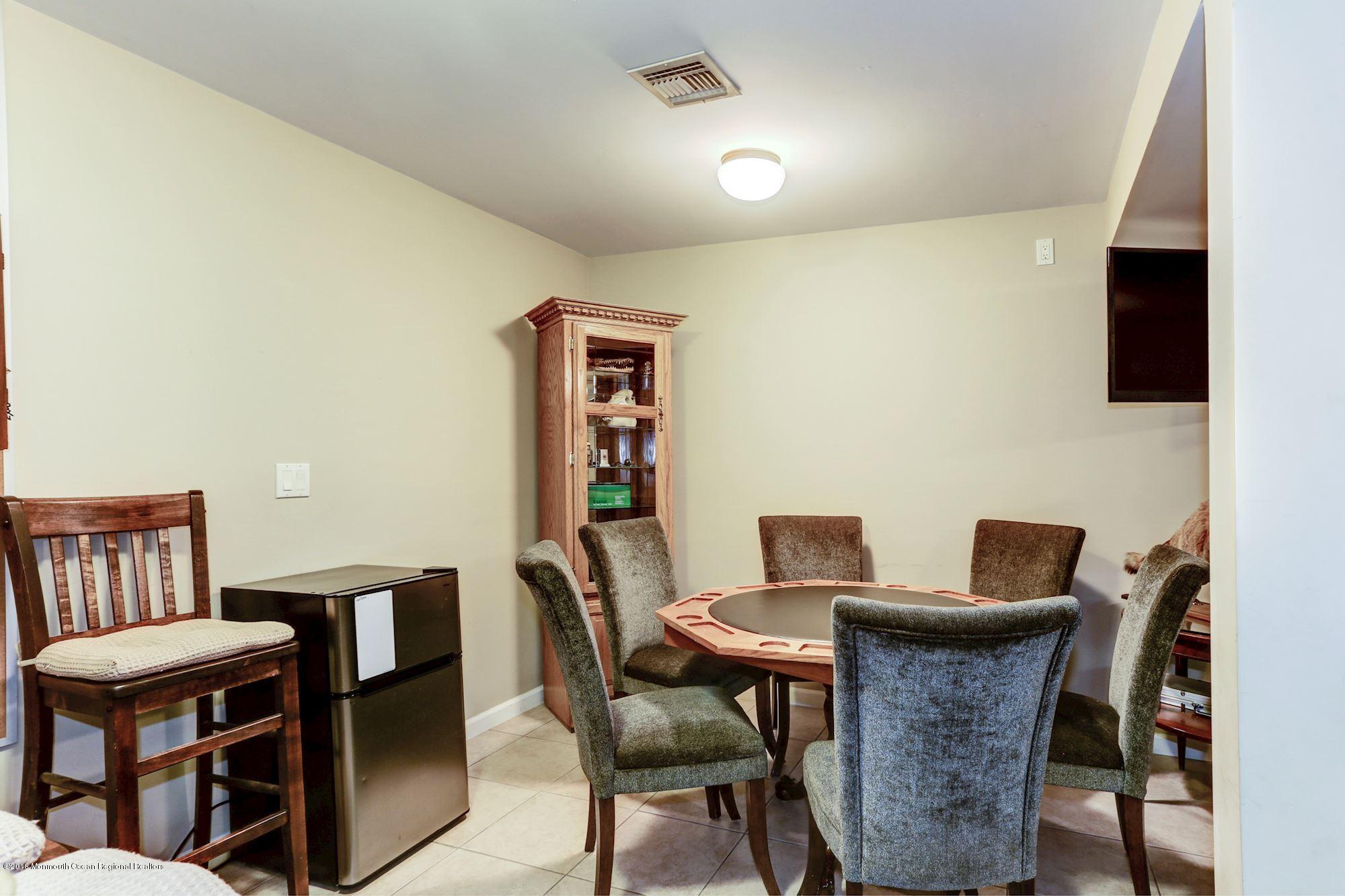 132 Brandon Road Manchester Township, NJ 08759 - Photo 16 of 24 a view of a dining room with furniture and a potted plant