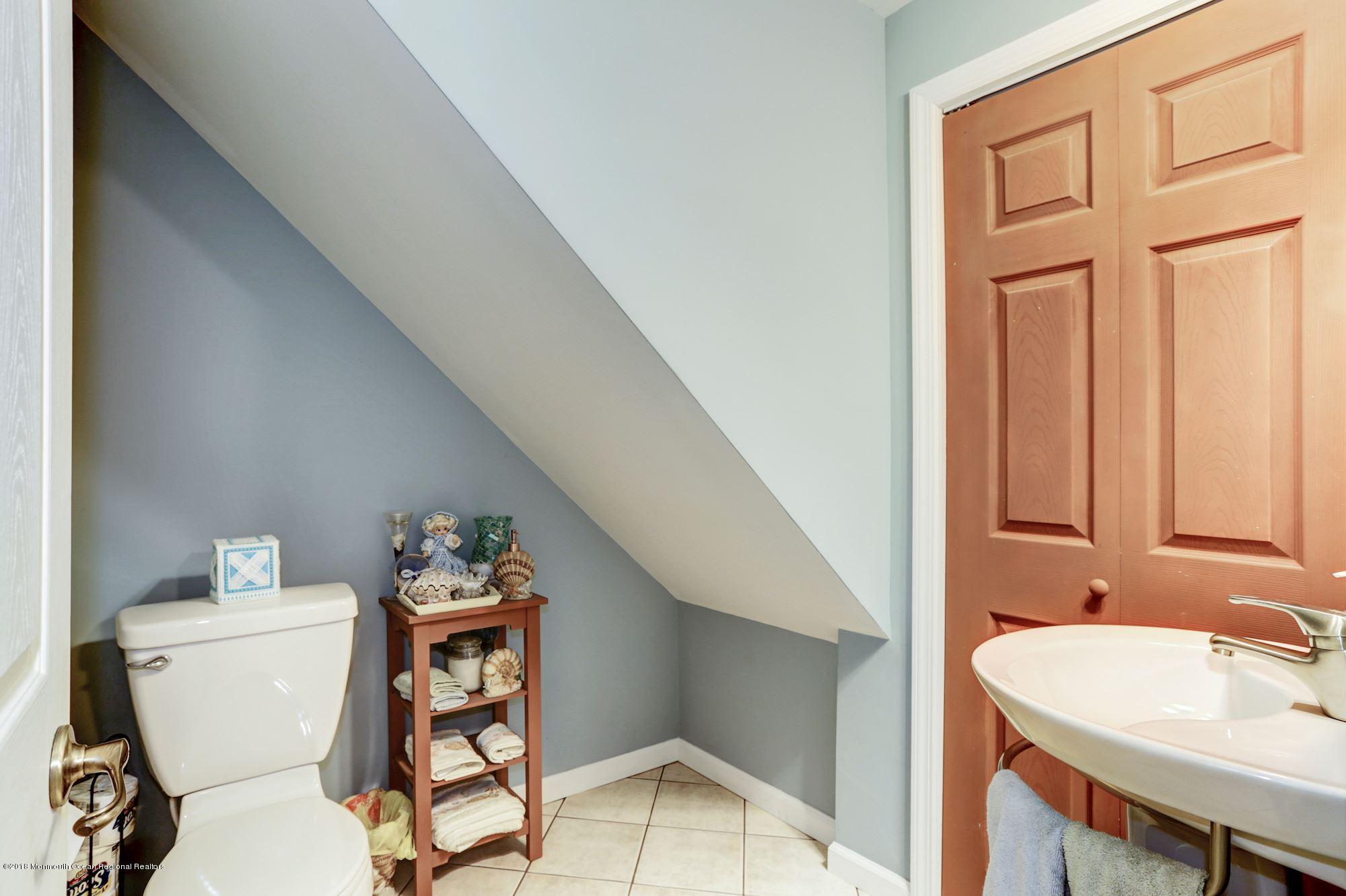 132 Brandon Road Manchester Township, NJ 08759 - Photo 20 of 24 a bathroom with a sink a toilet and a mirror