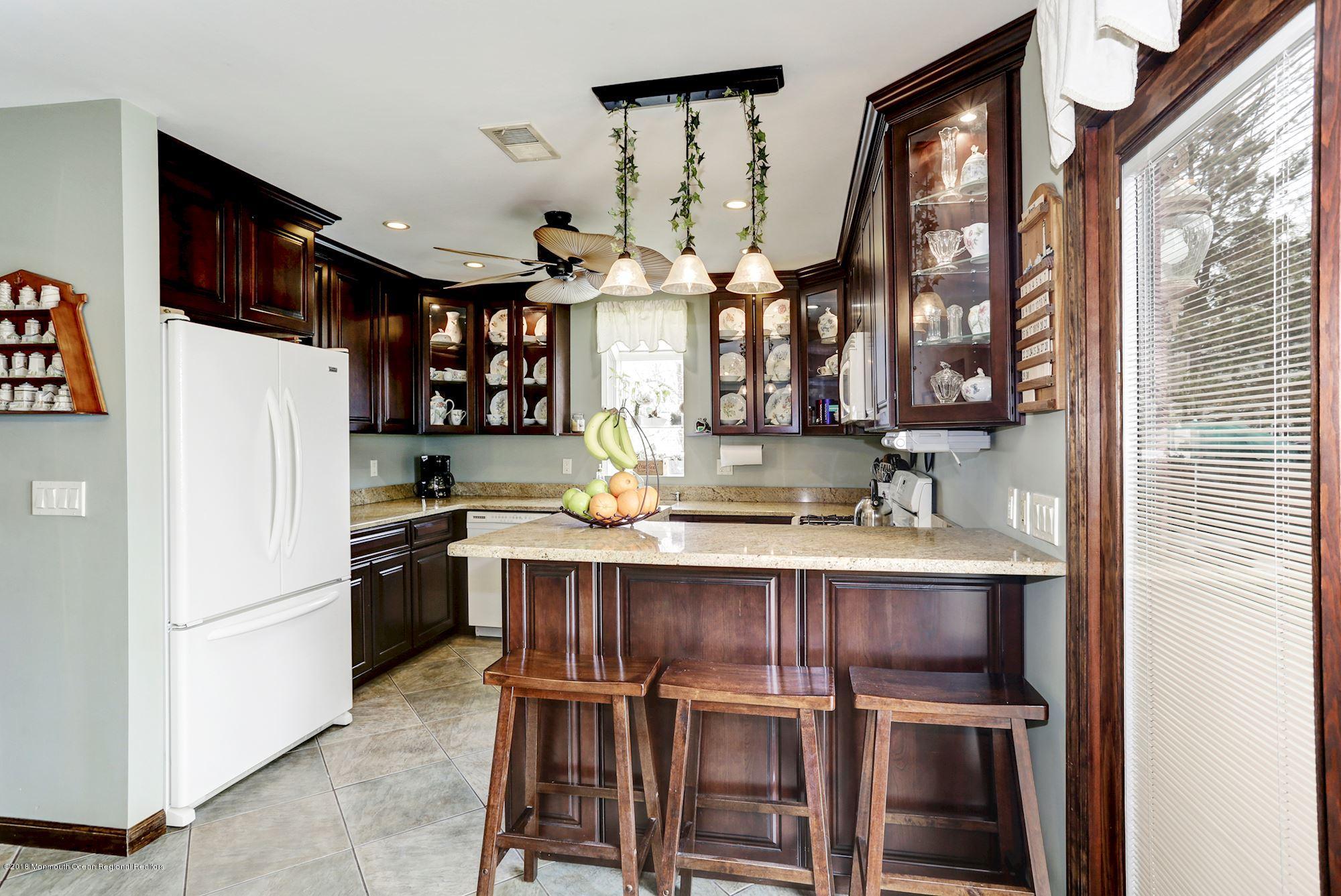 132 Brandon Road Manchester Township, NJ 08759 - Photo 3 of 24 a kitchen with stainless steel appliances granite countertop a refrigerator and a stove top oven