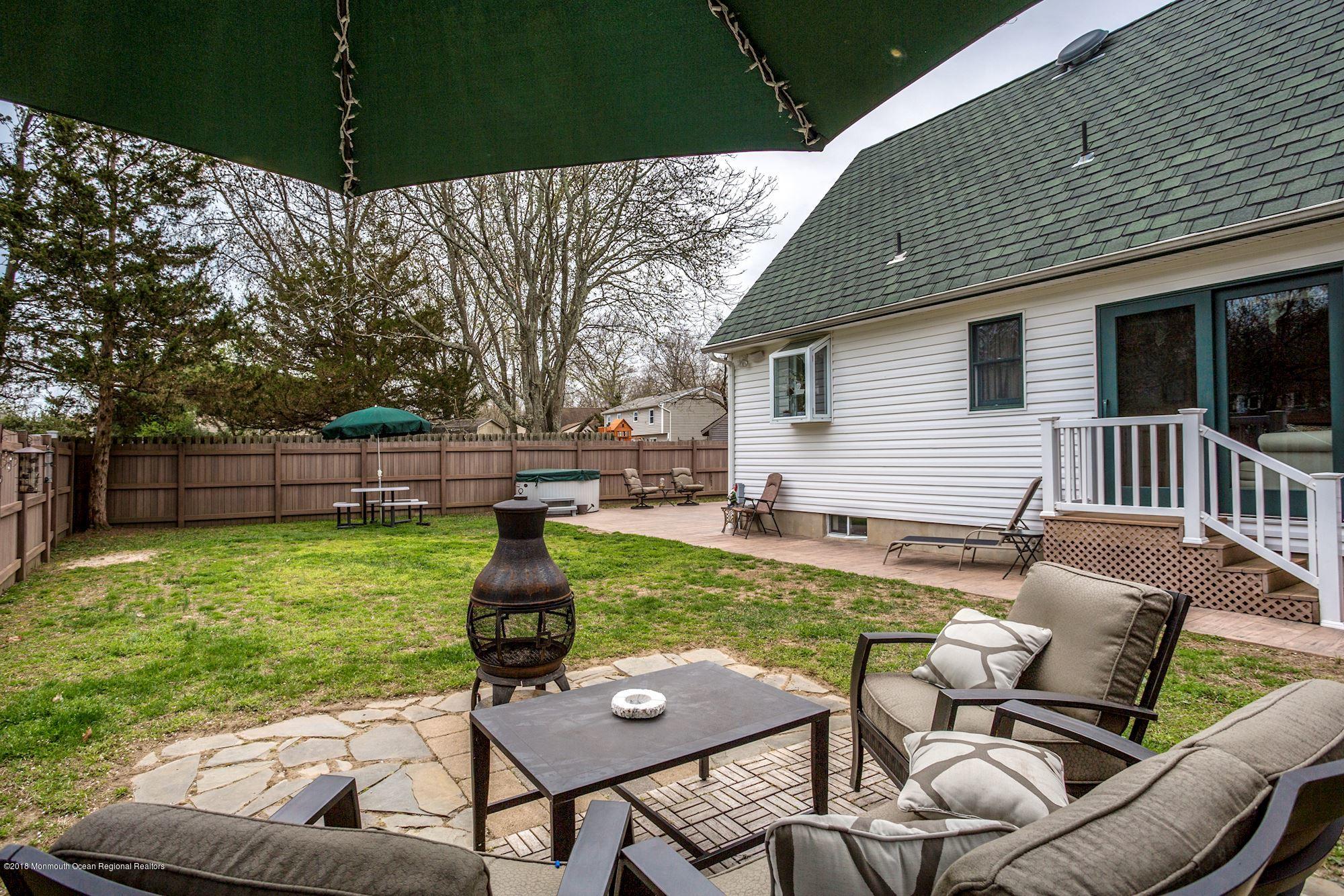 132 Brandon Road Manchester Township, NJ 08759 - Photo 23 of 24 a front view of a house with garden