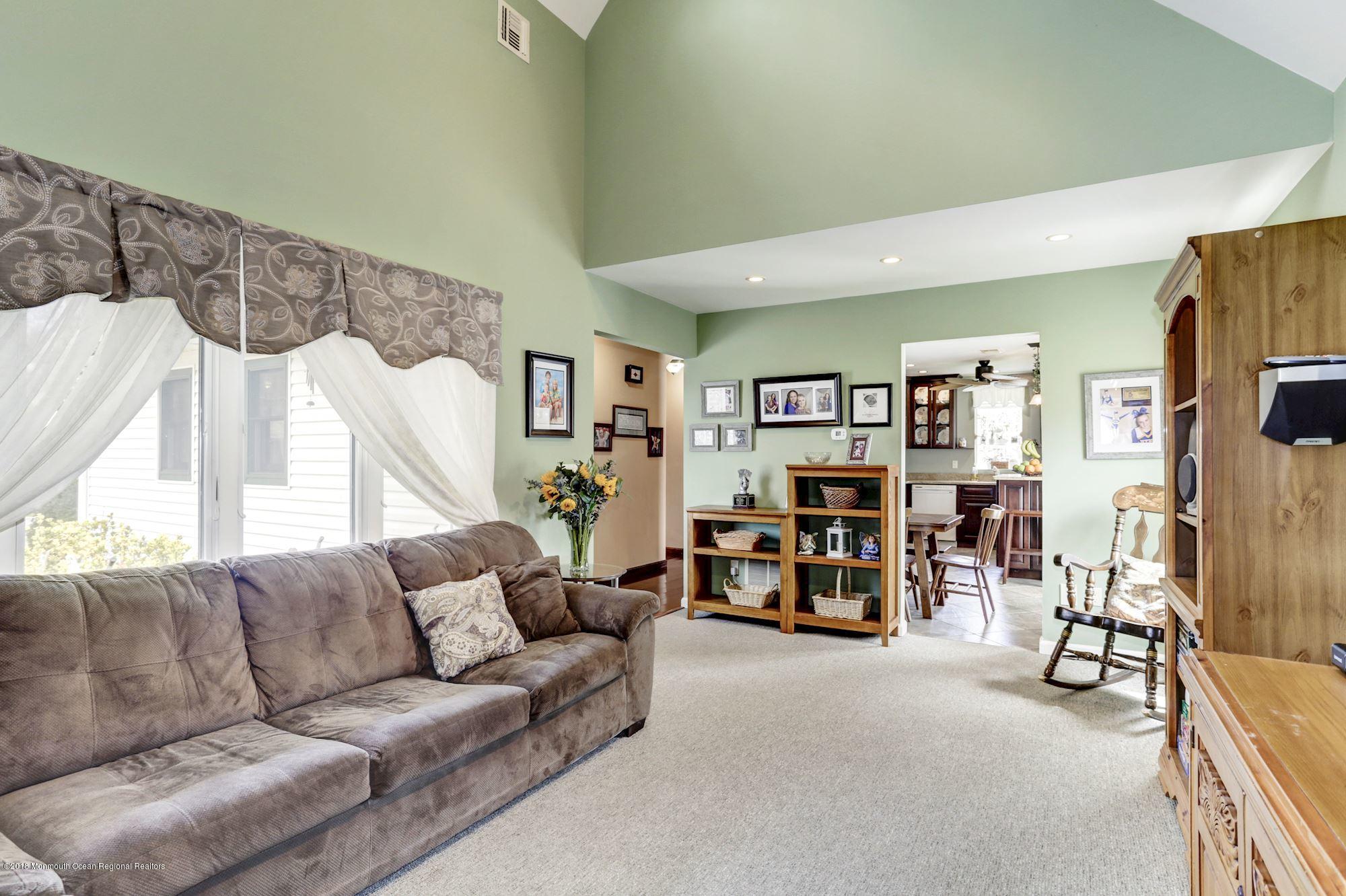 132 Brandon Road Manchester Township, NJ 08759 - Photo 4 of 24 a living room with furniture and a flat screen tv