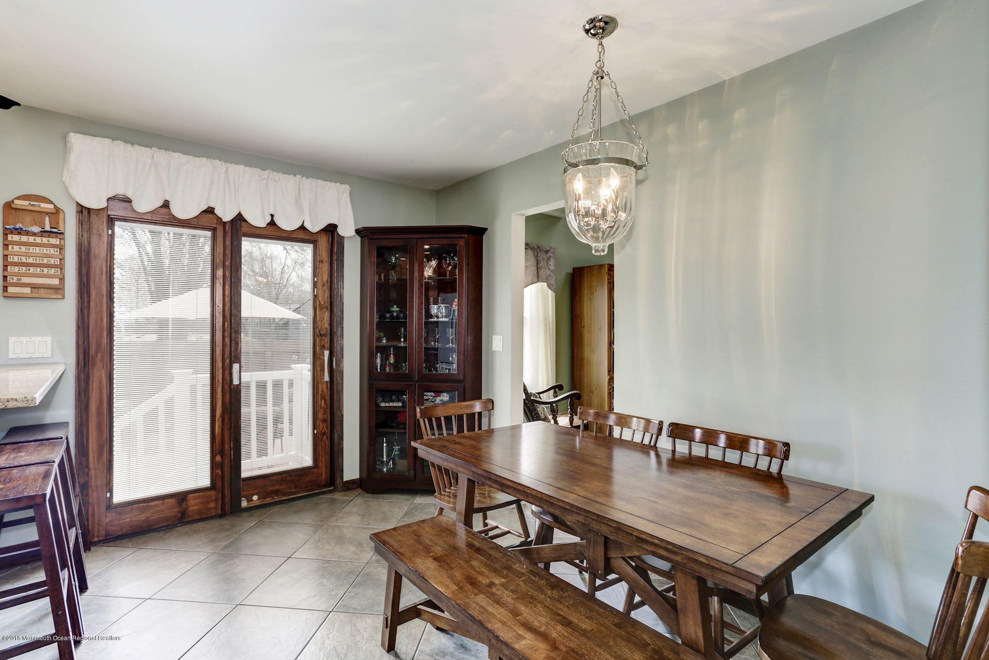 132 Brandon Road Manchester Township, NJ 08759 - Photo 5 of 24 a view of a dining room with furniture and a chandelier