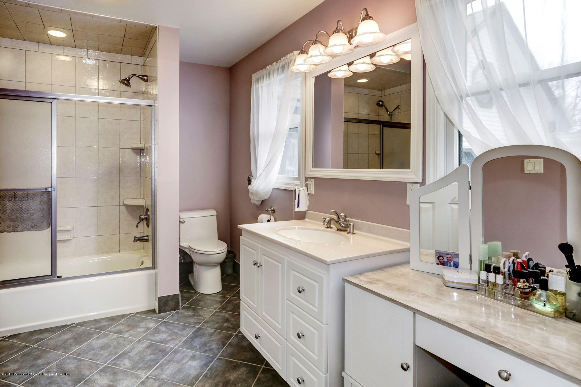 132 Brandon Road Manchester Township, NJ 08759 - Photo 9 of 24 a bathroom with a double vanity sink mirror and shower