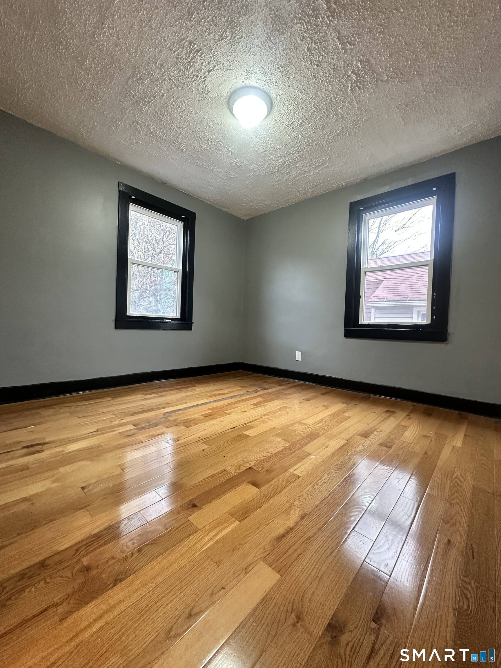 302 Dover Street Bridgeport, CT 06610 - Photo 15 of 40 a view of an empty room with window