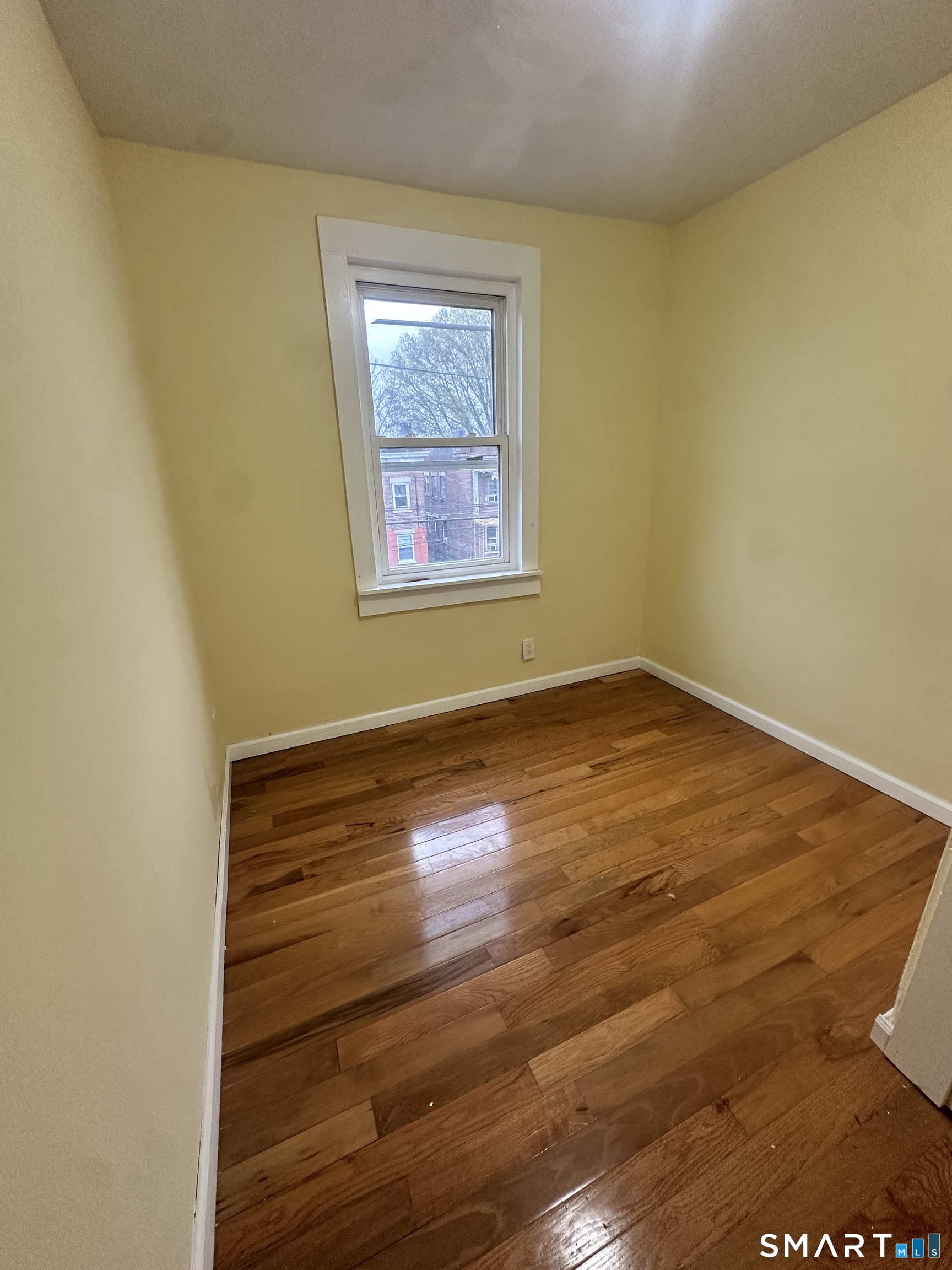 302 Dover Street Bridgeport, CT 06610 - Photo 24 of 40 a view of empty room with wooden floor