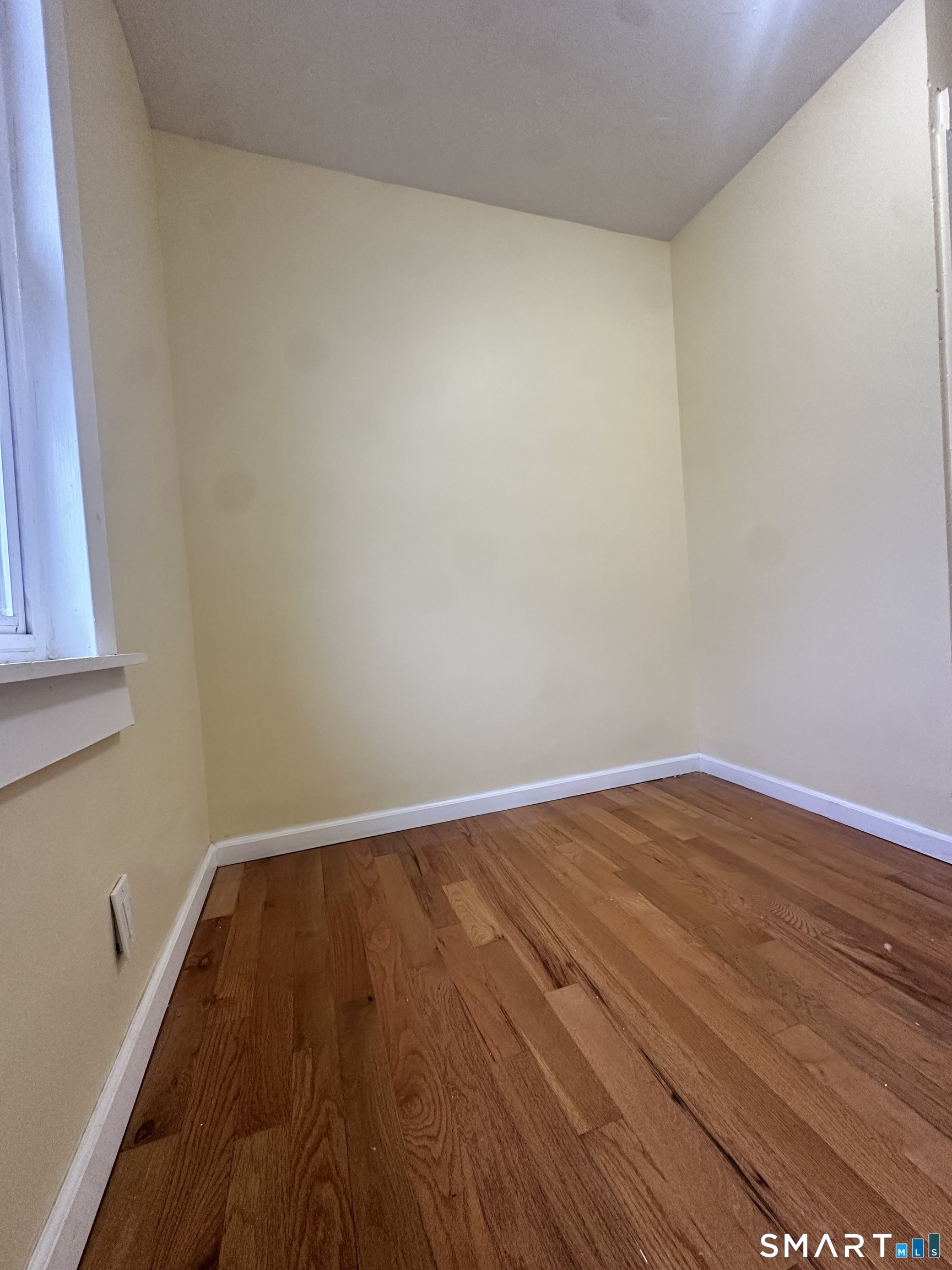 302 Dover Street Bridgeport, CT 06610 - Photo 25 of 40 a view of wooden floor in a room