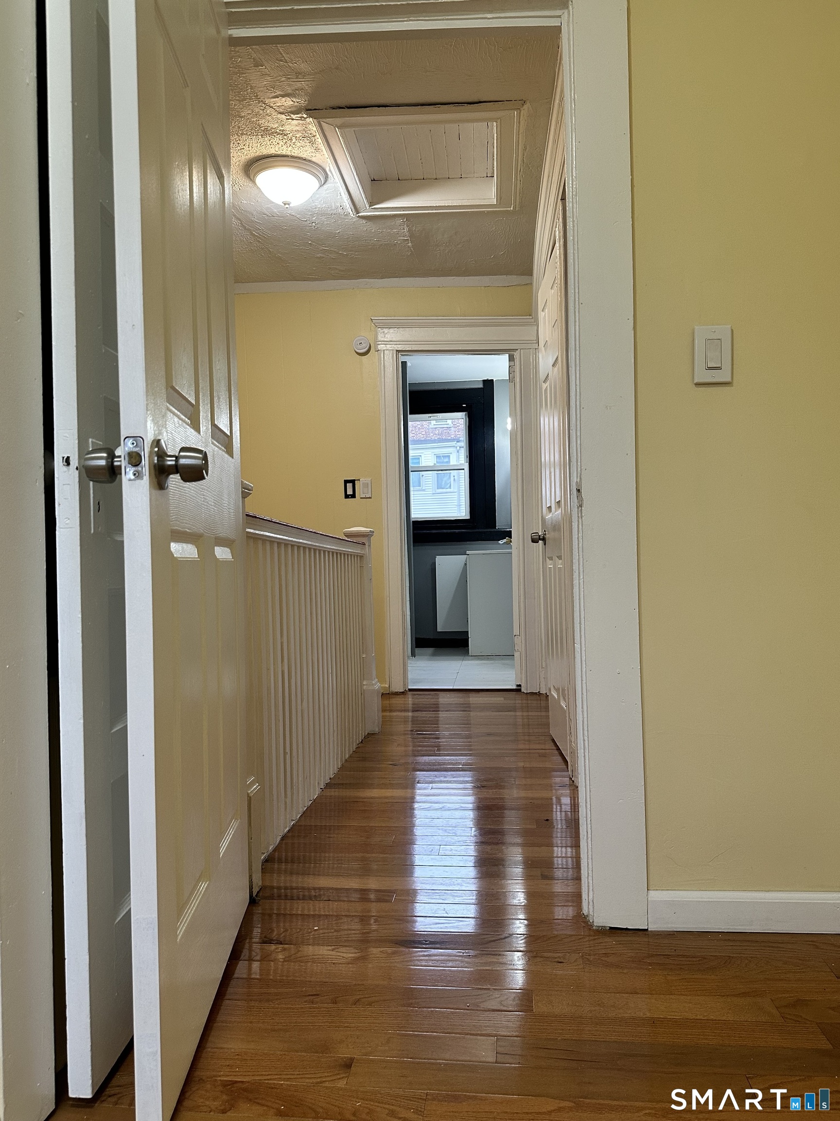 302 Dover Street Bridgeport, CT 06610 - Photo 28 of 40 a view of a hallway with wooden floor
