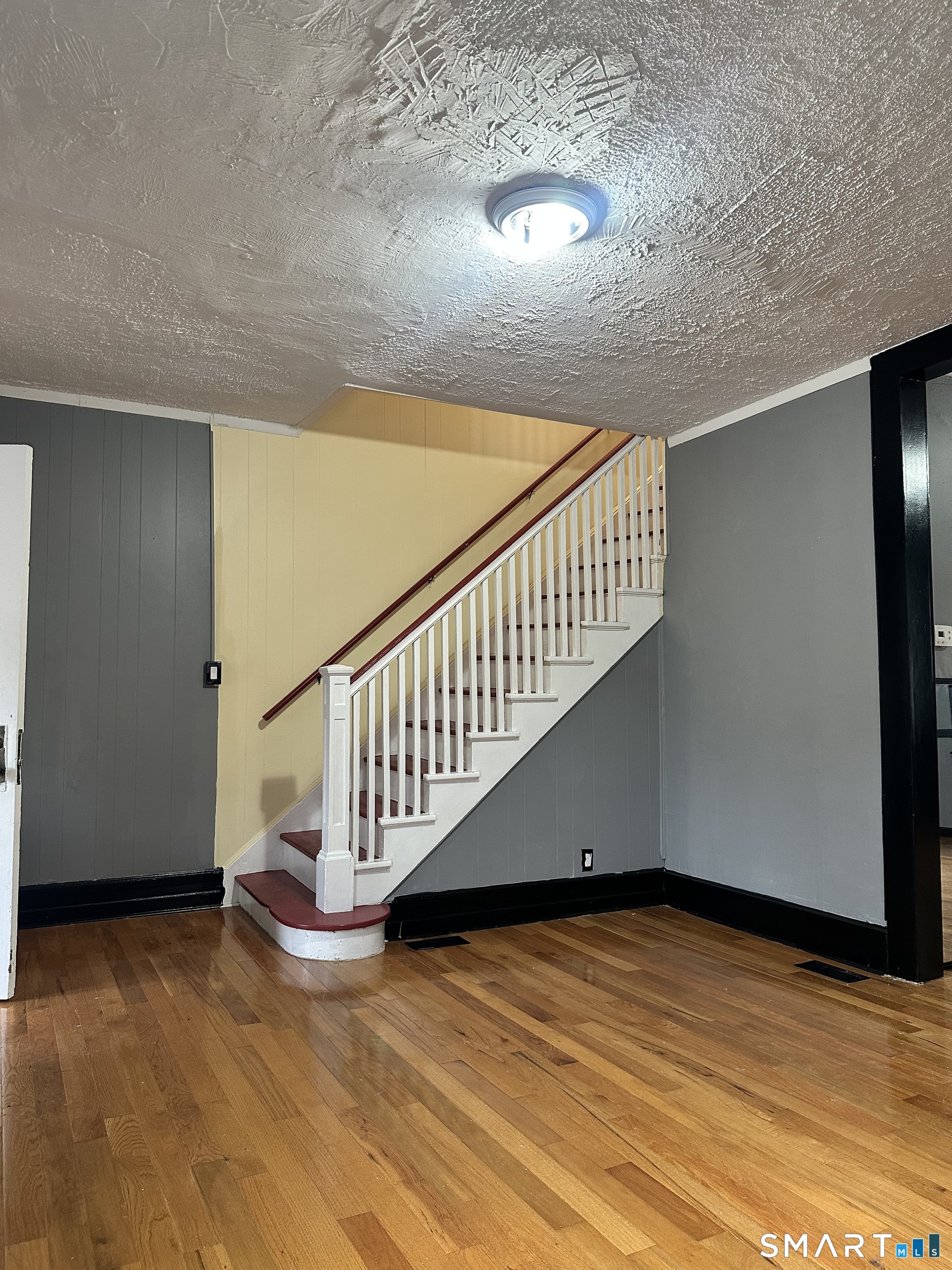 302 Dover Street Bridgeport, CT 06610 - Photo 3 of 40 a view of a room with wooden floor