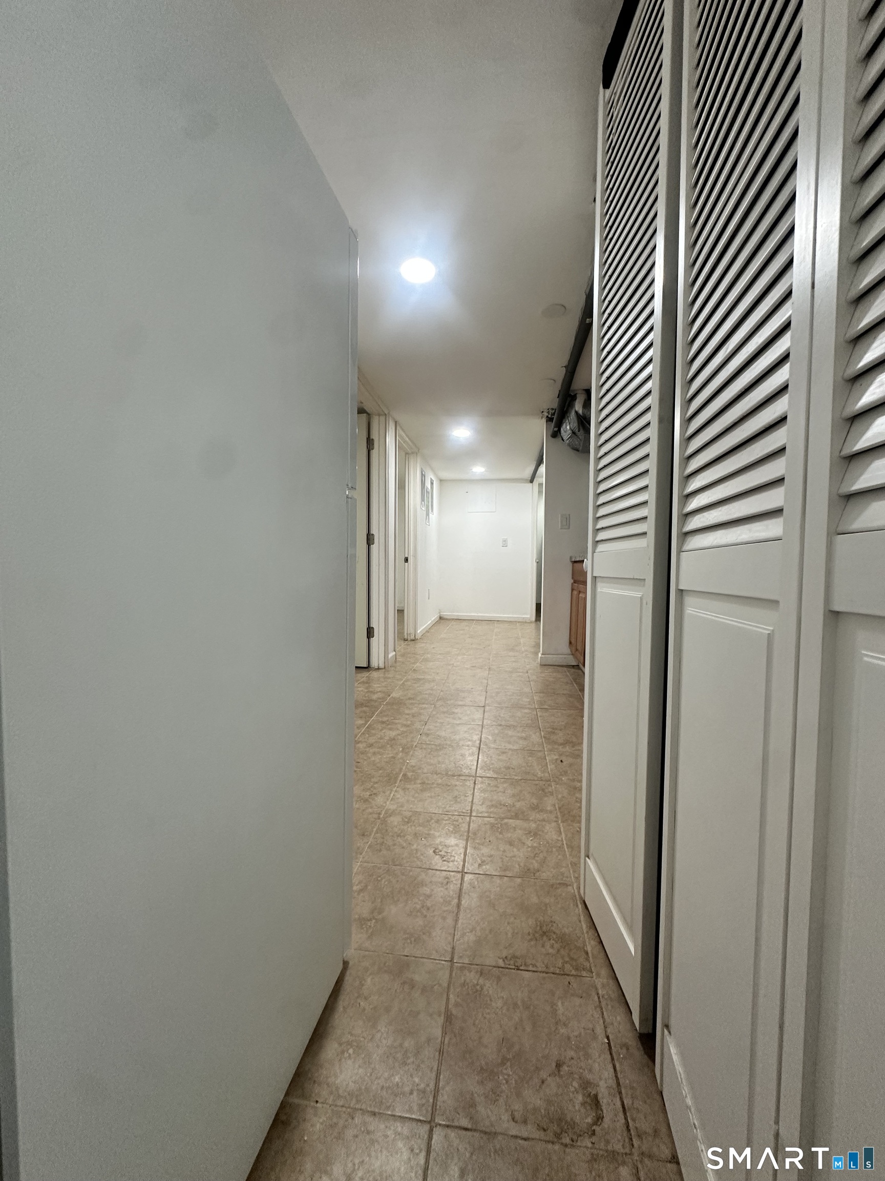302 Dover Street Bridgeport, CT 06610 - Photo 8 of 40 a view of hallway with a bathroom