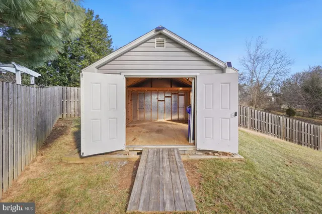a view of a room with wooden walls