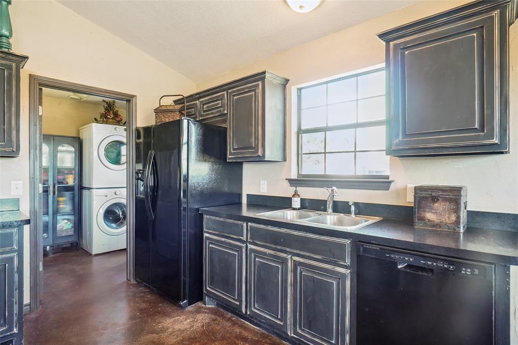 2454 Decatur Tx 76234 Decatur, TX 76234 - Photo 12 of 35 a kitchen with stainless steel appliances granite countertop a refrigerator and a sink
