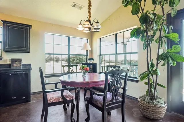 a dining room with furniture and window