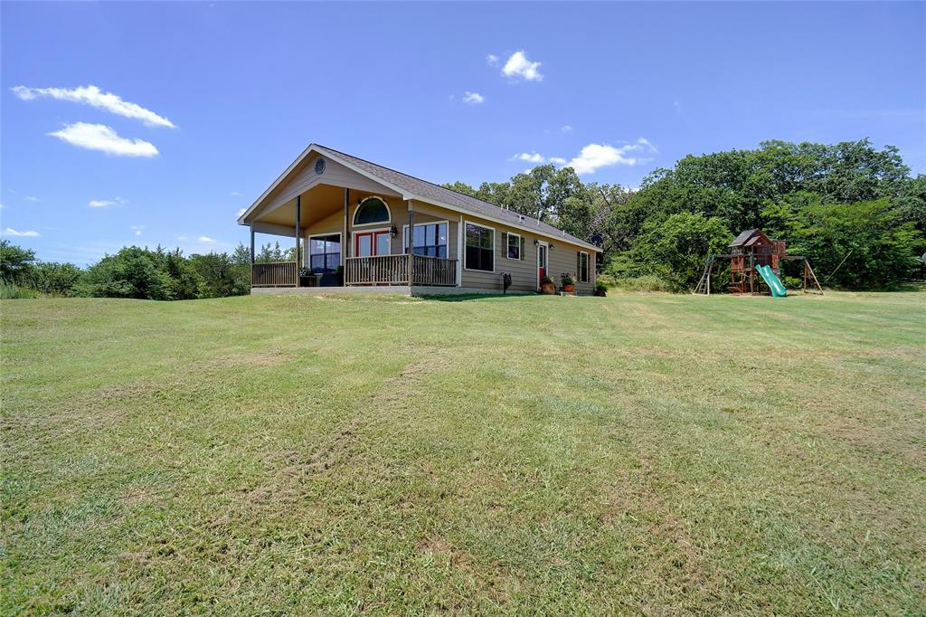 2454 Decatur Tx 76234 Decatur, TX 76234 - Photo 2 of 35 a house with huge green field in front of it