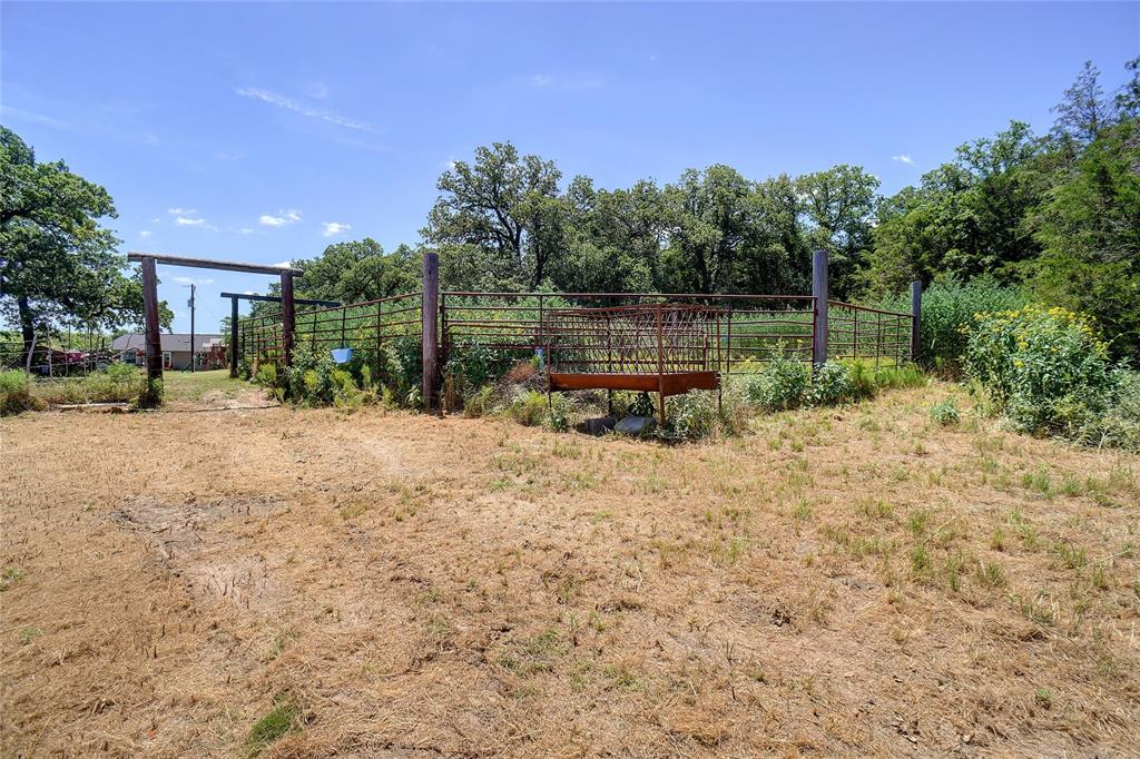 2454 Decatur Tx 76234 Decatur, TX 76234 - Photo 26 of 35 a backyard of a house with table and chairs