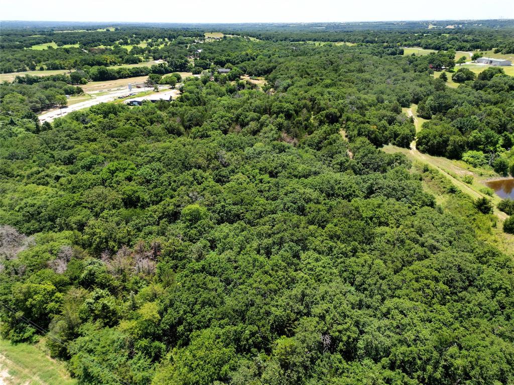 2454 Decatur Tx 76234 Decatur, TX 76234 - Photo 31 of 35 an aerial view of residential houses with outdoor space and trees