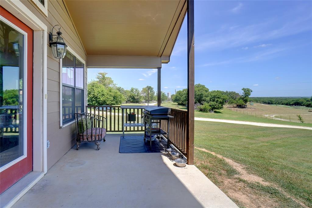 2454 Decatur Tx 76234 Decatur, TX 76234 - Photo 5 of 35 a view of a balcony with floor to ceiling window and wooden fence