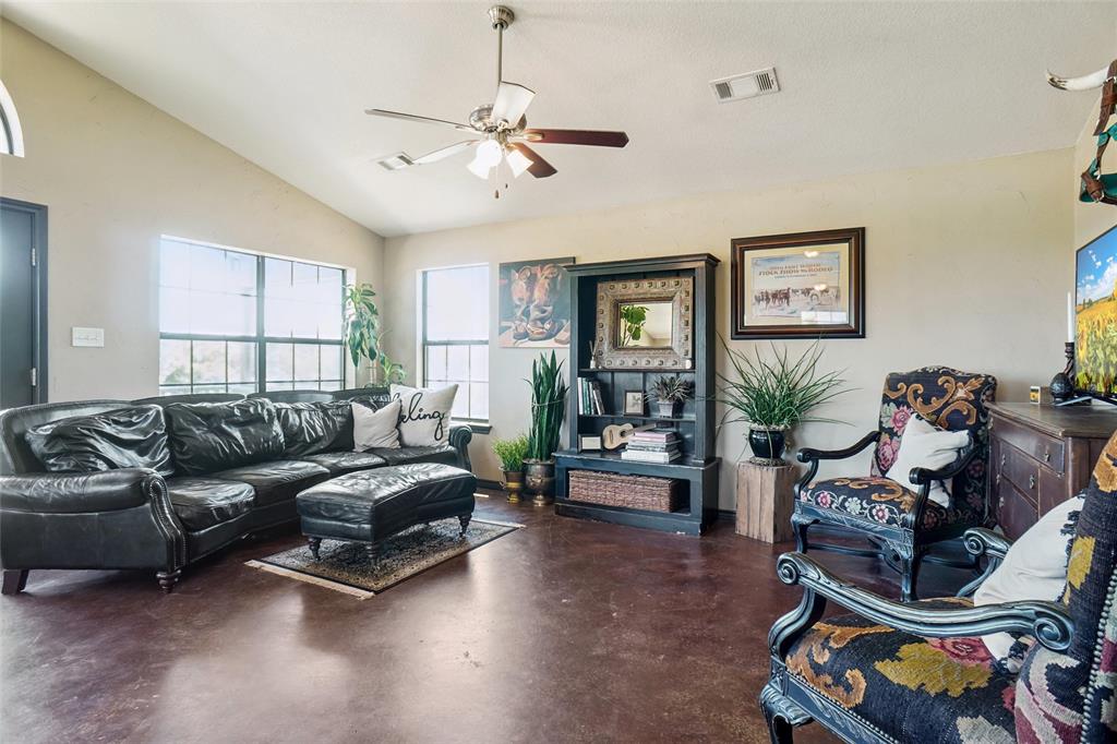 2454 Decatur Tx 76234 Decatur, TX 76234 - Photo 6 of 35 a living room with furniture a window and a flat screen tv