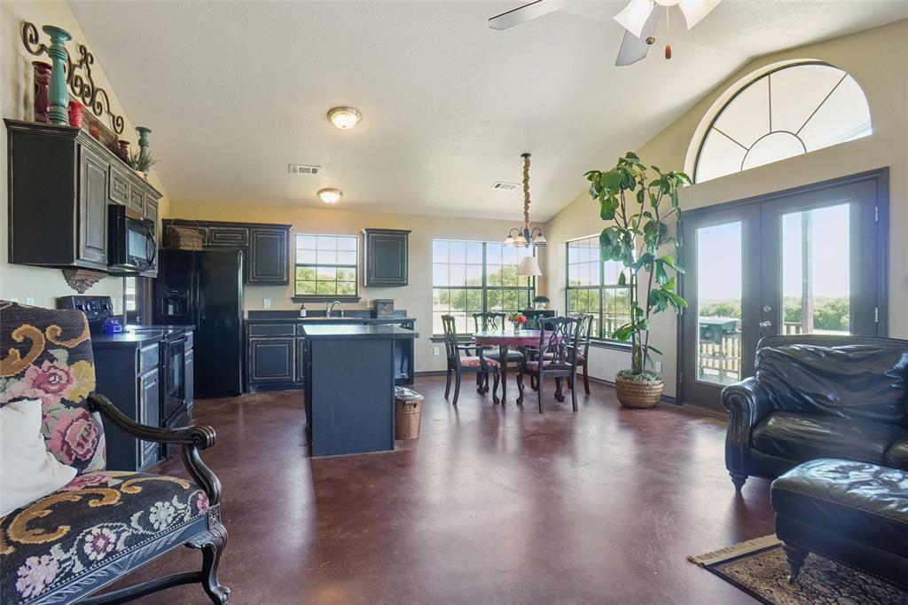 2454 Decatur Tx 76234 Decatur, TX 76234 - Photo 8 of 35 a view of a dining room with furniture window and wooden floor