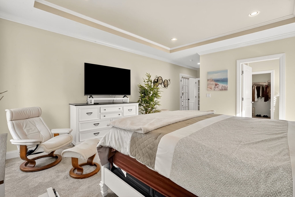 48 Liberty Lane Enfield, CT 06082 - Photo 27 of 32 a bedroom with furniture and a flat screen tv