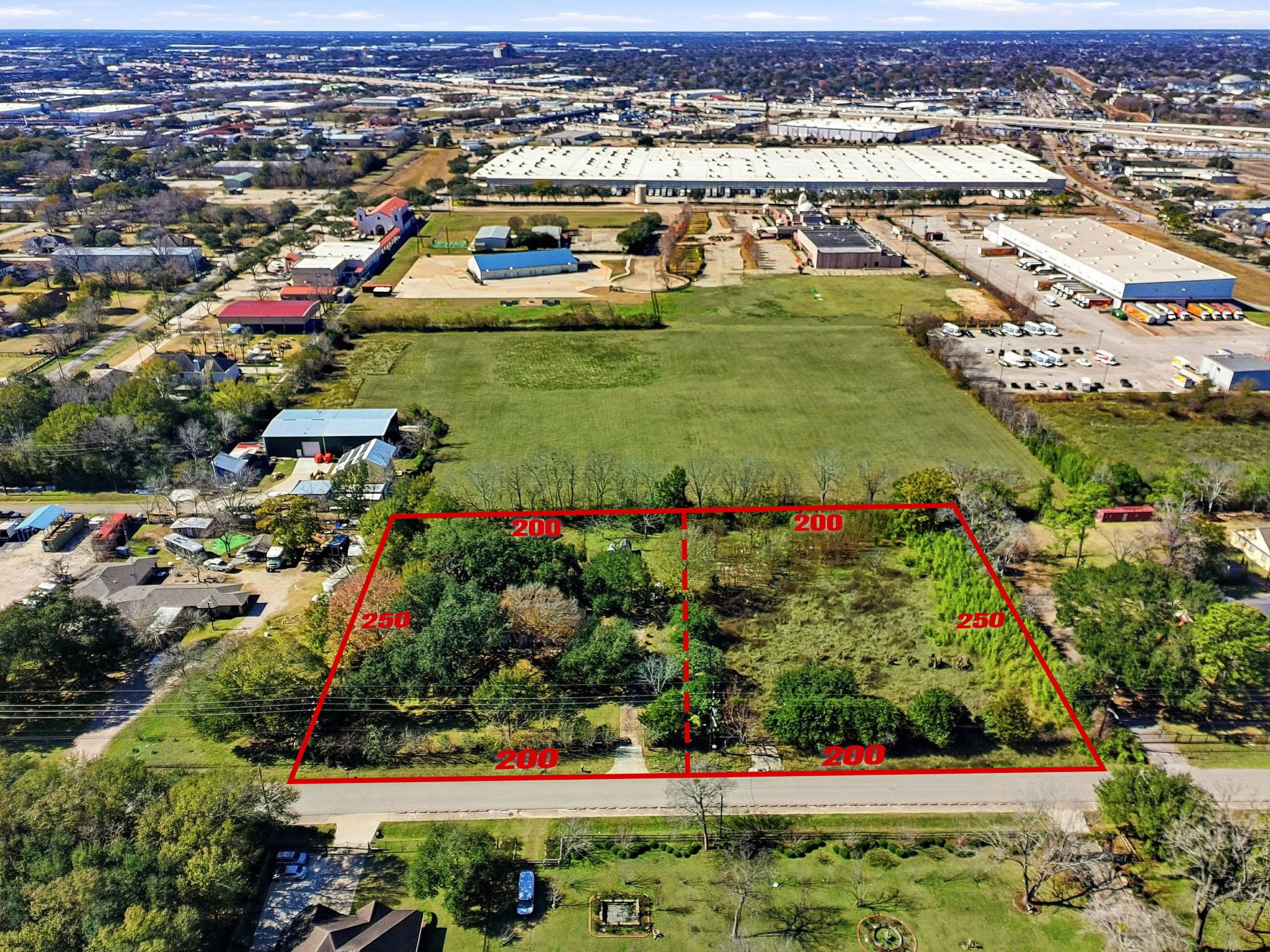 an aerial view of a houses and an outdoor space