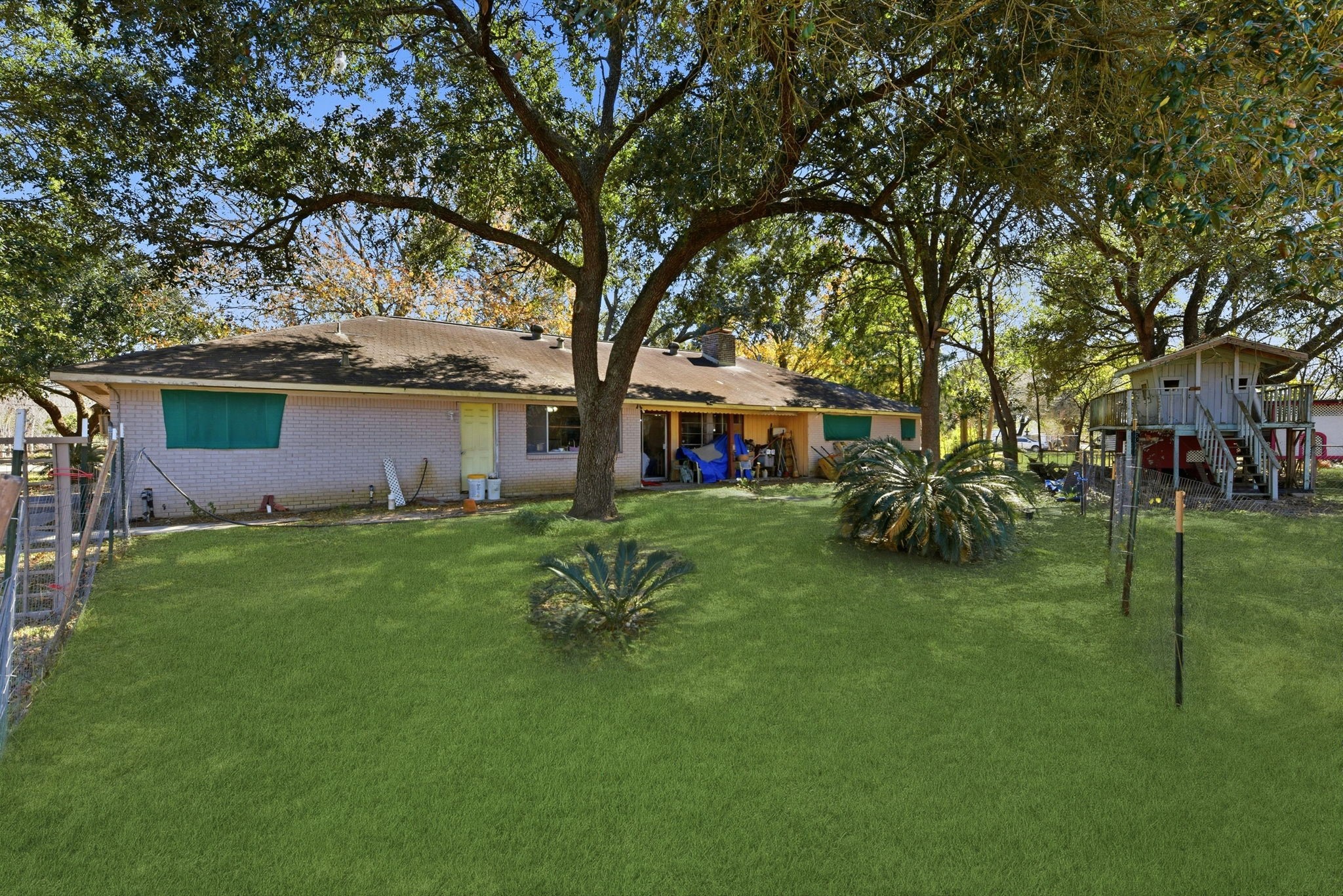 11902 Dover Street Houston, TX 77031 - Photo 15 of 29 a front view of a house with a garden and yard