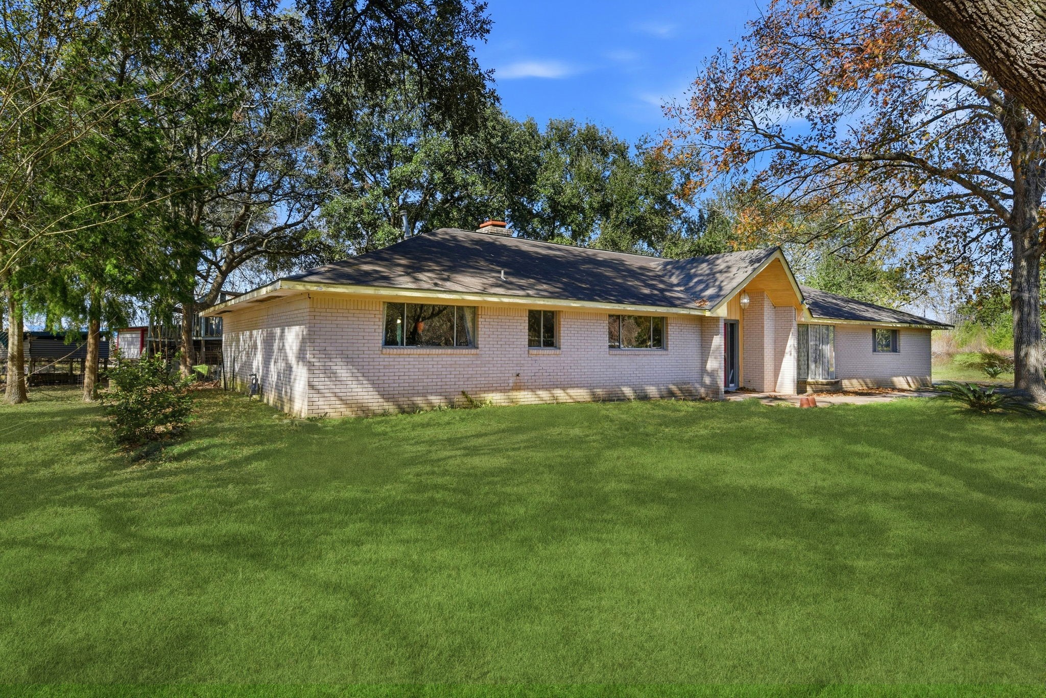 11902 Dover Street Houston, TX 77031 - Photo 7 of 29 a front view of a house with a garden