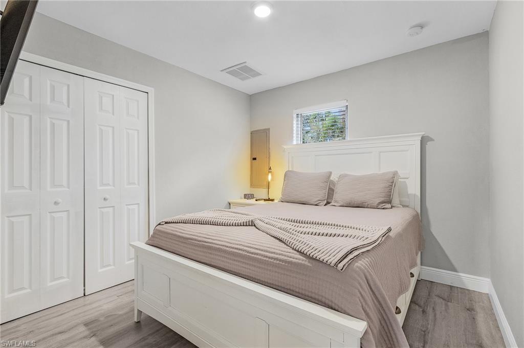 16075 Quail Trail Bokeelia, FL 33922 - Photo 11 of 24 a bedroom with a bed and a window