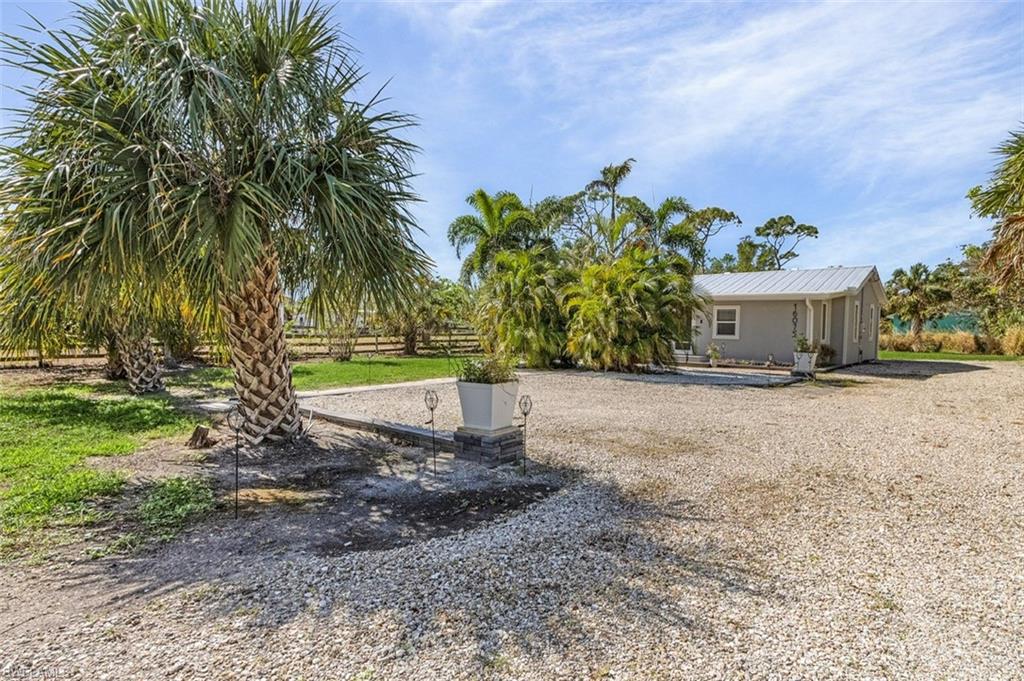 16075 Quail Trail Bokeelia, FL 33922 - Photo 2 of 24 a view of a house with a yard
