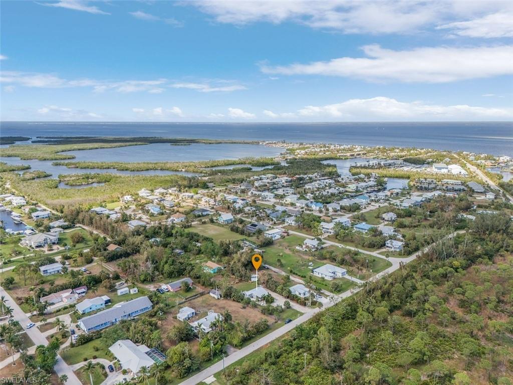 16075 Quail Trail Bokeelia, FL 33922 - Photo 24 of 24 an aerial view of residential building and ocean